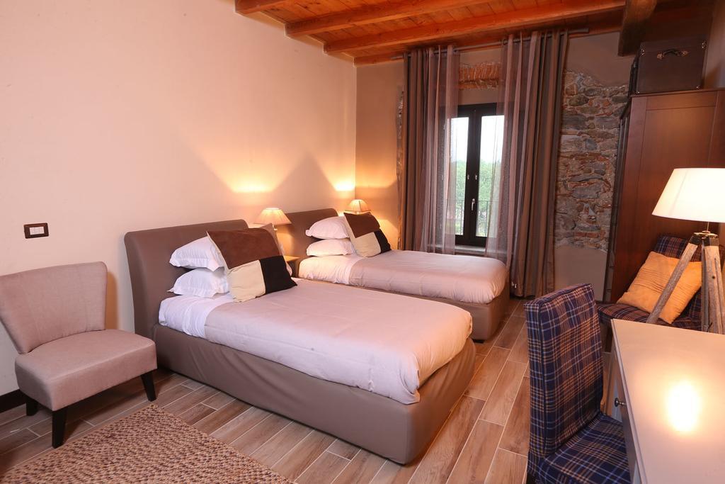 Hotel Equirelais Lomnago Habitación foto